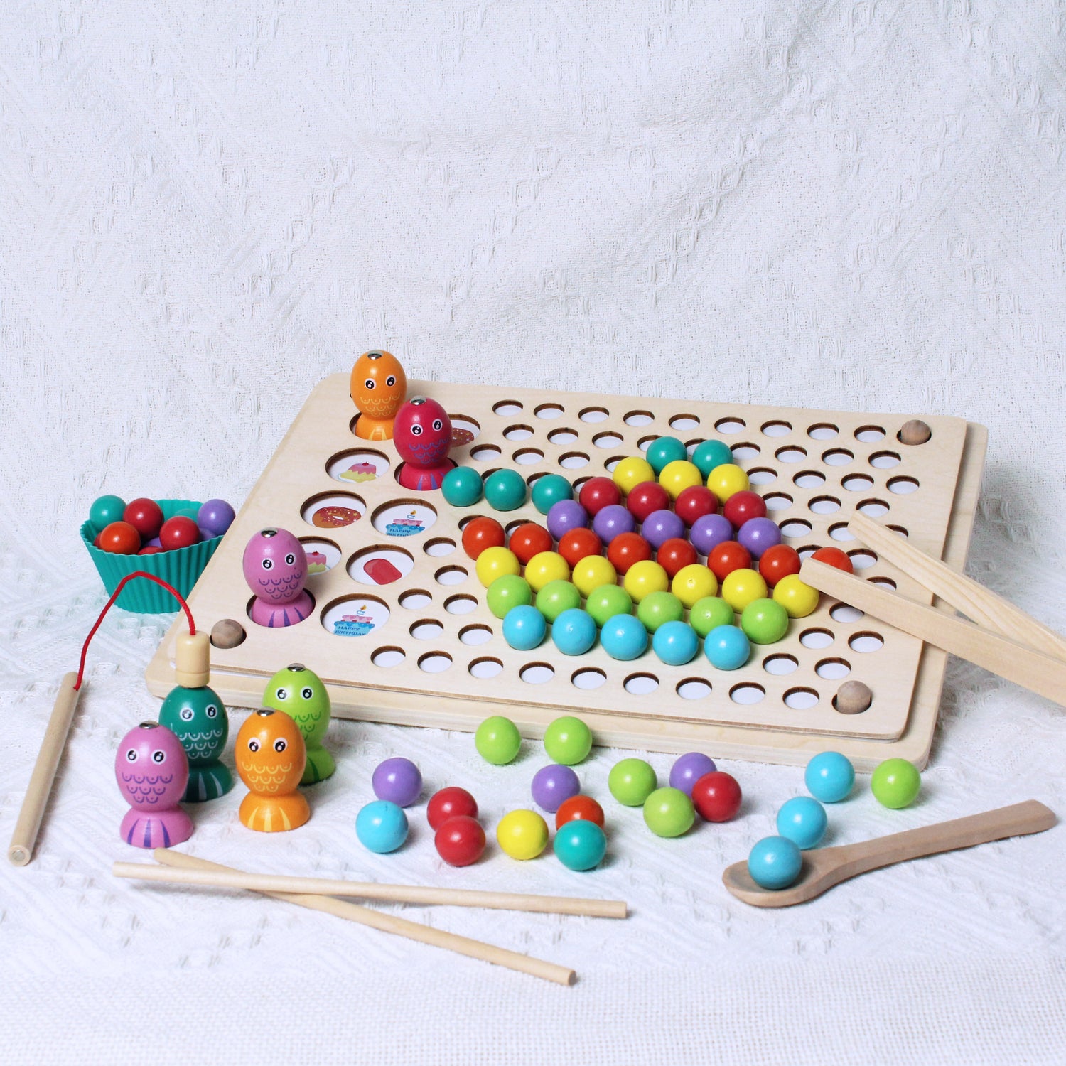 creating picture with colourful wooden balls sorting game and colourful wooden fishes fishing memory game, chopsticks, thong, spoon, fishing rod and silicone cups provided for fun and educational experience