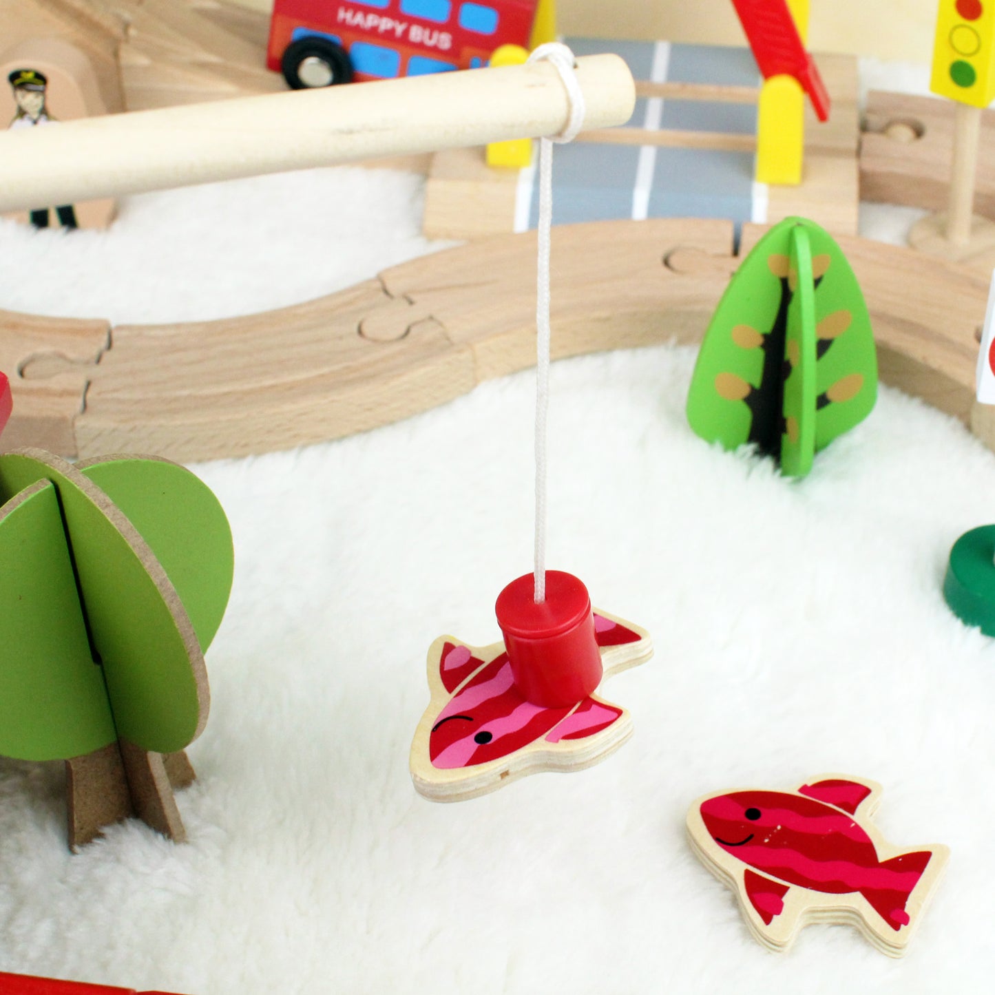 wooden train (station) toy set with bus, helicopter, trees, fishing, traffic lights