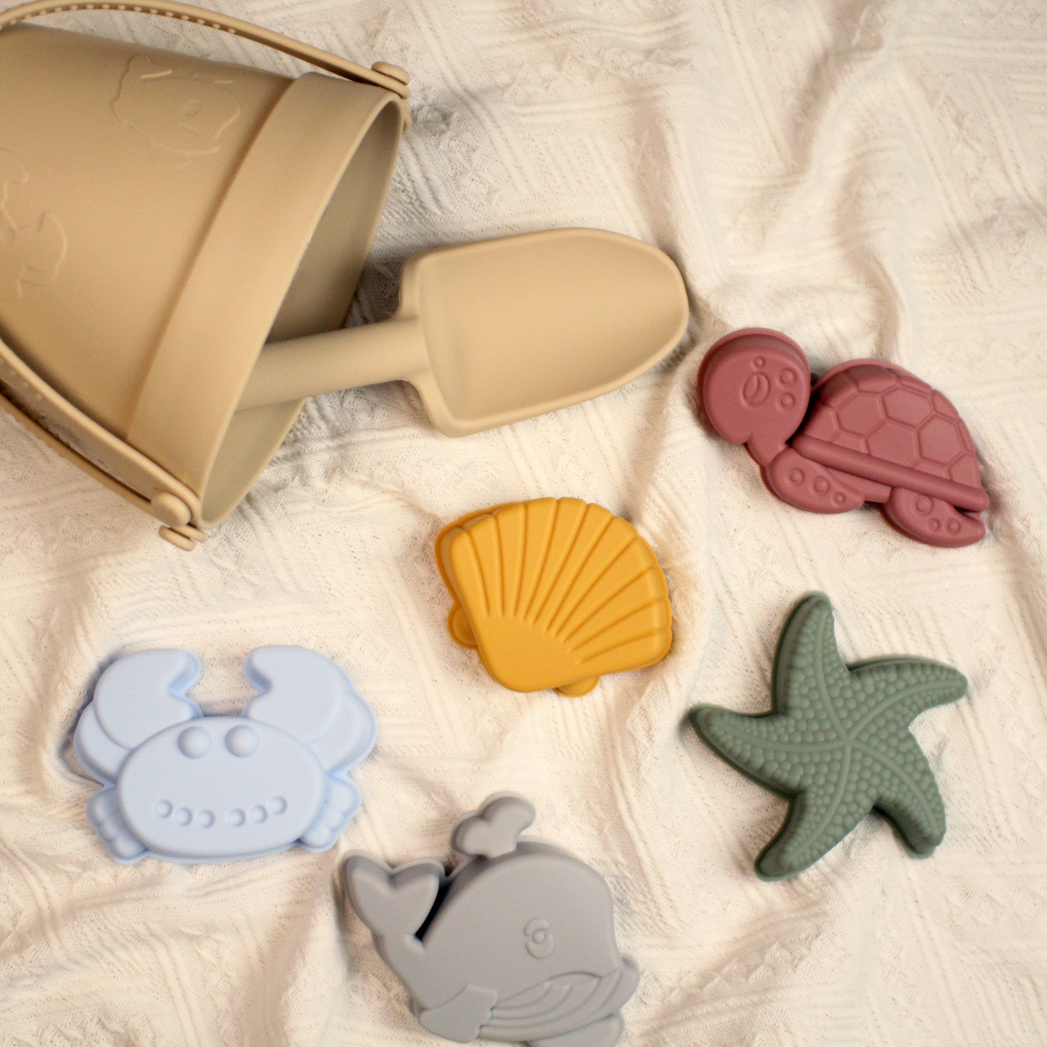 Beige silicone beach play set with bucket and colour sea creatures silicone molds, sand castles